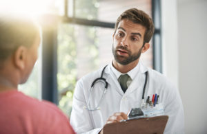 male doctor talking with a patient