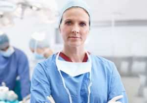 Female physician in operating room