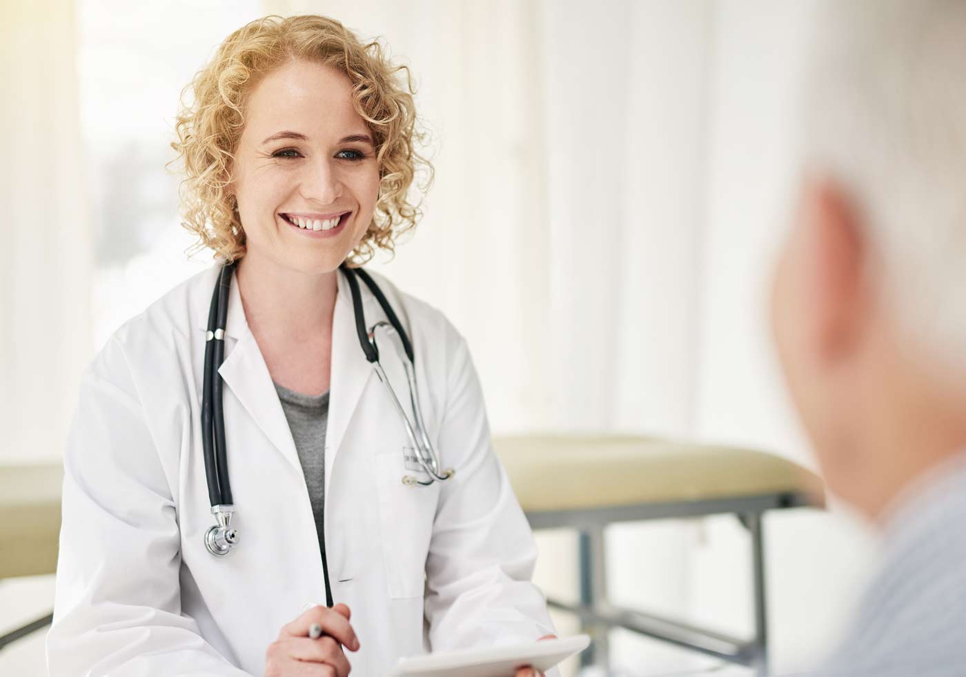 Female physician talking to patient - American Osteopathic Board of ...